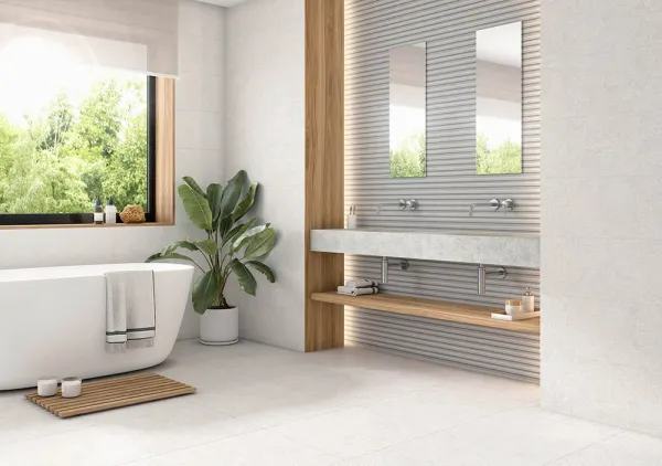 Baño con azulejos efecto terrazo en tonos neutros, colección Linz de Proconcept