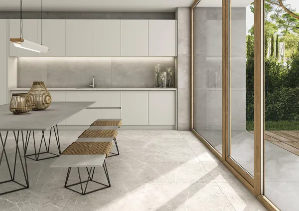 Cocina con azulejos efecto cemento en tonos neutros, colección Cosmopolita de TAU ceràmica