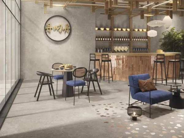 Comercio con azulejos efecto cemento en tonos cálidos, colección Ama de Ape