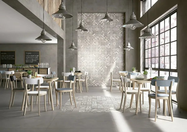 Comercio con azulejos efecto cemento en tonos neutros, colección Block de Marazzi