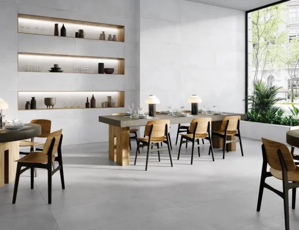 Comercio con azulejos efecto cemento en tonos neutros, colección Chrome de Metropol