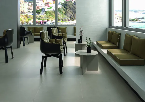 Comercio con azulejos efecto cemento en tonos neutros, colección Cricket de Cifre