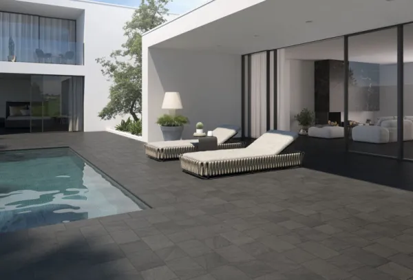 Exterior con azulejos efecto piedra en tonos neutros, colección Arán de Bestile