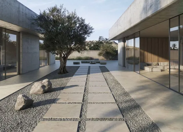 Exterior con azulejos efecto piedra en tonos neutros, colección Haven de Peronda