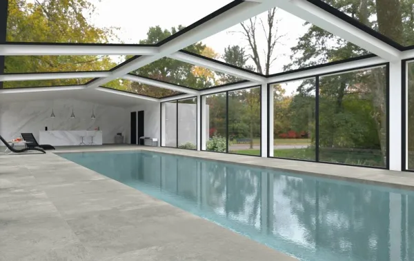 Piscina con azulejos efecto cemento, colección Moma de Grespania