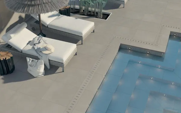 Piscina con azulejos efecto cemento, colección Planet de Peronda