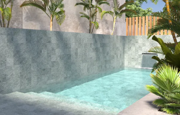 Piscina con azulejos efecto piedra en tonos fríos, colección Mijaran de Dune