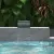 Piscina con azulejos efecto piedra en tonos fríos, colección Pietrasanta de Dune